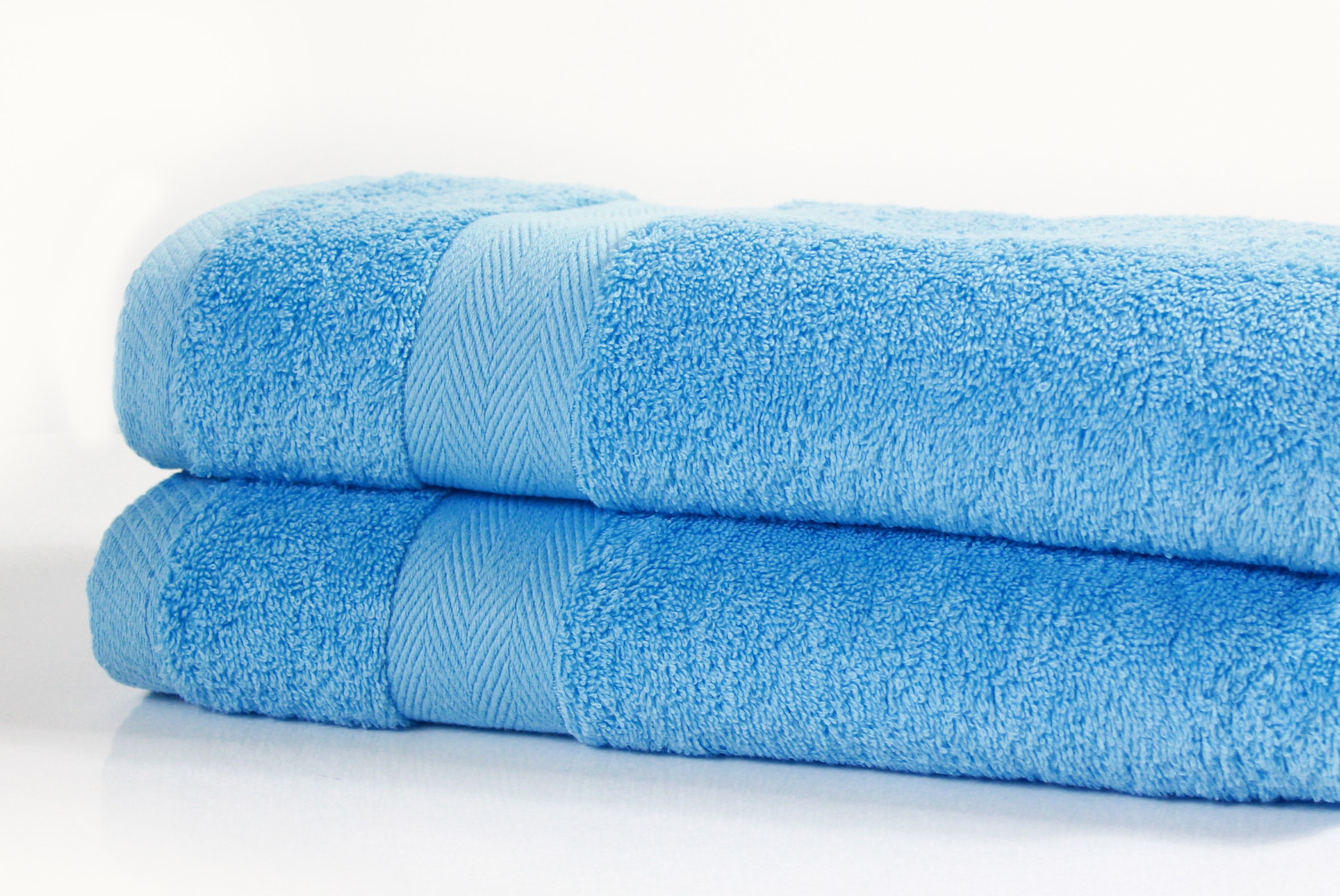 luxor cobalt blue bath towels 600gsm combed cotton stacked